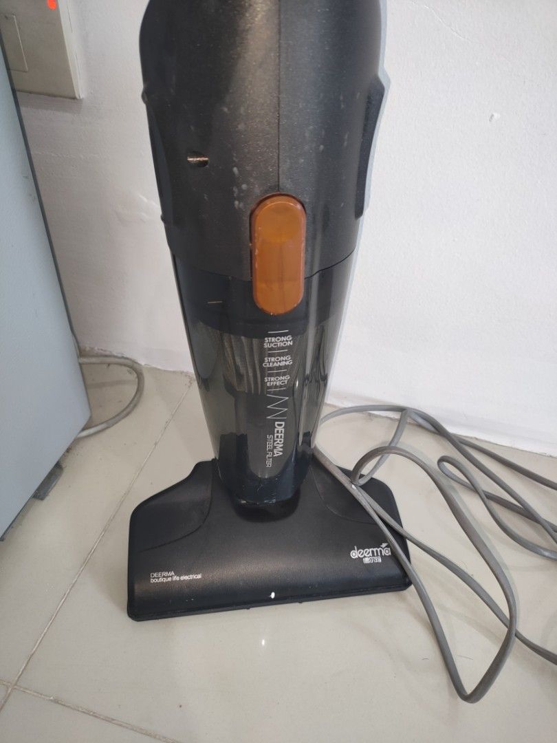 Deerma Stick Vacuum Cleaner (Category: Vacuum Cleaner & Housekeeping) located in Quezon City. Submitted by maxsab (Listing ID 1464667100, Image 3). Description: - Comes with box and three suction heads - Can be handheld or with stand - Powerful suction for quick cleanups - Lightweight and easy to maneuver - Corded electric for continuous power - Ideal for everyday cleaning needs - Includes main unit and floor head - Ready for a new home - Has som