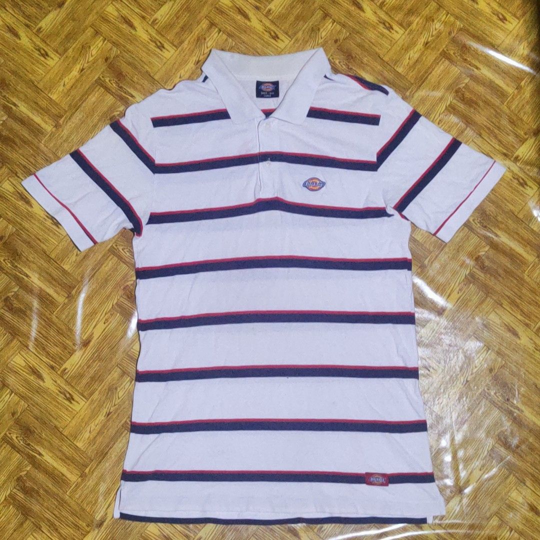 Dickies Striped Polo Shirt - Size Large (Category: Tshirts & Polo Shirts ) located in Cagayan de Oro. Submitted by royalriver_549ef2 (Listing ID 1464653120, Image 2). Description: - Thrifted - L31/W19 - Classic Dickies polo shirt - Color: White with navy and red stripes - Features iconic Dickies logo on chest - Small tag detail on hem - Comfortable and stylish for everyday wear - Size: Large Note: It have small hole and the collar is yellowish.