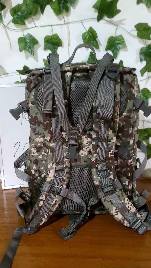 Digital Camouflage Tactical Backpack Molle Outdoor Bag (Category: Backpacks) located in Baguio. Submitted by phoeberose33384 (Listing ID 1464765477, Image 3). Description: - Digital camouflage tactical backpack measuring approx. 20" x 13" - Multiple spacious compartments with heavy-duty zippers - Molle webbing on front and sides for extra attachments - Padded mesh shoulder straps with adjustable buckles and cross sternum strap for comfort - Velcr