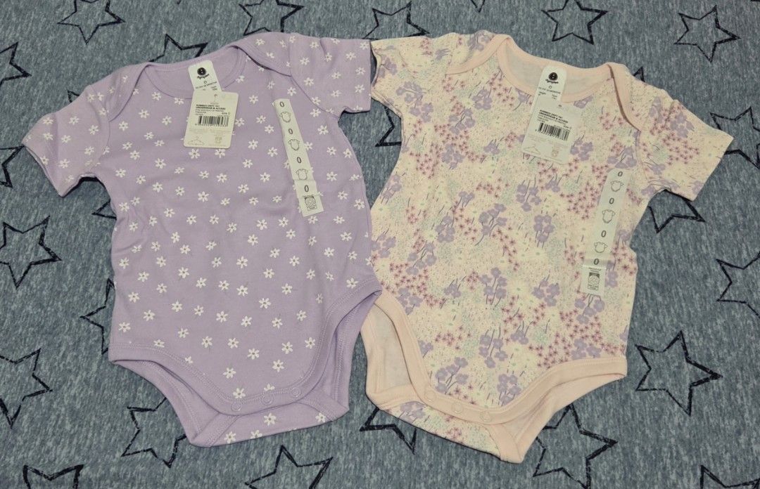 Dimples Baby Bodysuits Size 0 Floral 2-Pack (Category: Babies & Kids Fashion) located in Valenzuela. Submitted by empot08 (Listing ID 1464769413, Image 1). Description: - Brand: Dimples (Both come with original store tags attached) - Size: Size 0, fits up to 12 months (76cm, 10kg) - Set includes: 2 short-sleeve bodysuits (1 lilac with white daisy print, 1 pinkish with multi-color floral pattern) - Material: Ultra-soft cotton for baby's comfort - 