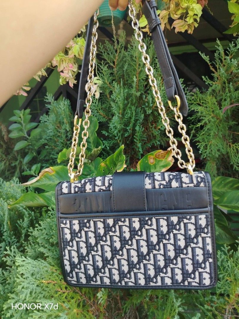Dior Oblique Canvas & Leather Flap Bag (Category: Luxury Bags & Wallets) located in Manila. Submitted by nikkaverda42241 (Listing ID 1464578462, Image 3). Description: - Classic Dior flap bag - Iconic Oblique canvas with black leather trim - Gold-tone CD clasp closure - Chain strap with leather shoulder pad - Interior zip pocket - Versatile for day or night use.