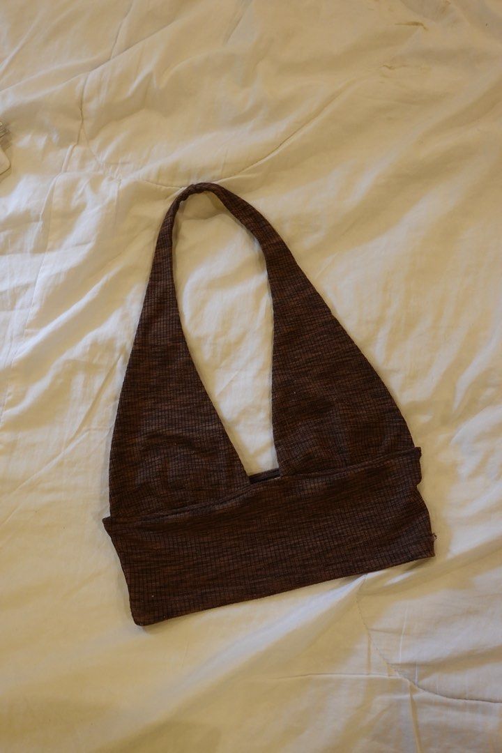 Divided H&M Brown Ribbed Halter Top XS (Category: Sleeveless) located in Pasig City. Submitted by hulyascloset (Listing ID 1464620406, Image 1). Description: - Brand: Divided by H&M - Color: Brown - Style: Ribbed Halter Top - Size: XS - Features: Subtle checkered texture, ties at the neck - Versatility: Perfect for layering or wearing on its own.