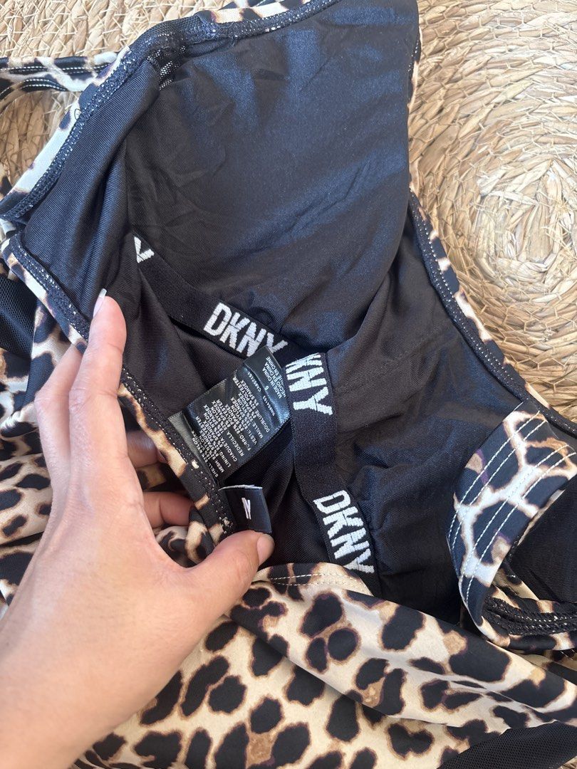 DKNY Leopard Print Padded One-Piece Swimsuit - Size 6 (Category: Bikinis & Swimsuits) located in Malabon City. Submitted by lheithriftshop (Listing ID 1464634962, Image 2). Description: - Cute DKNY one-piece swimsuit - Stylish leopard print - Size 6 - Built-in padding for a flattering fit - Chic mesh detail on the sides - Ideal for beach days or poolside lounging - Made in China.