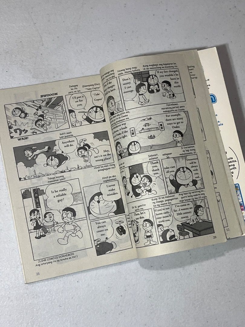 Doraemon Gadget Cat from the Future Volume 1 English Tagalog Comic (Category: Comics & Manga) located in Caloocan City. Submitted by rdtrmt (Listing ID 1464672103, Image 2). Description: - Shogakukan English Comics: Doraemon - Volume 1: The Gadget Cat from the Future - Story: A robot cat from 2112 travels back in time to help Nobita. - Features: Utilizes the magical 4-D Pocket for secret tools. - Author: Fujiko F. Fujio - The item is slightly use