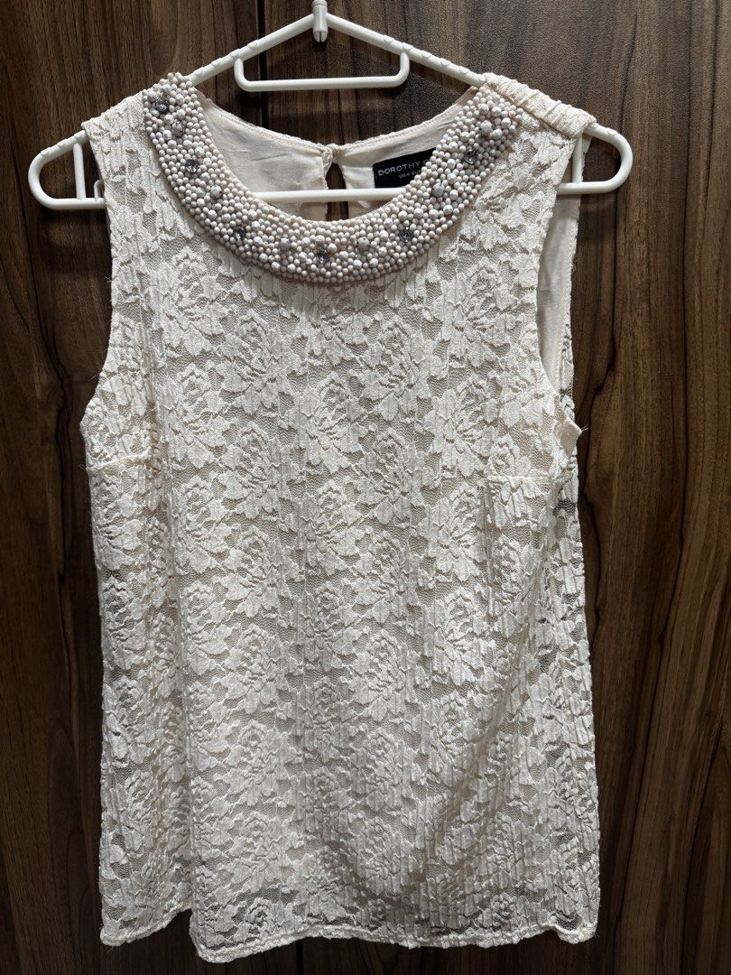 Dorothy Perkins - Lacey Sleeveless Top (Category: Sleeveless) located in Makati City. Submitted by eleanorsiy (Listing ID 1464580308, Image 1). Description: Dorothy Perkins Lacey Sleeveless Top US size 8 Barely used, cannot fit me anymore .