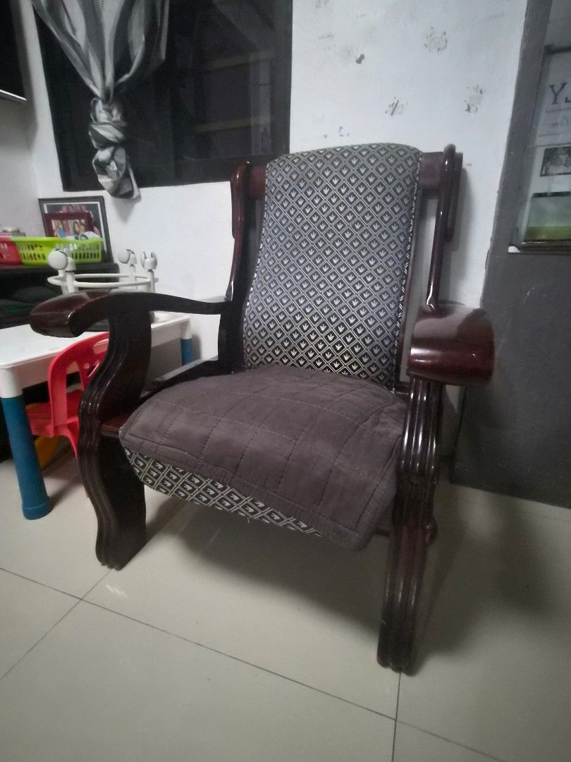Dragon Sala Set_ Sofa Chair with Patterned Cushions (Category: Sofas) located in Caloocan City. Submitted by grandflower.2c6677 (Listing ID 1464669684, Image 3). Description: - Elegant wooden sofa chair with a dark, polished finish. - Features comfortable patterned seat and back cushions. - Includes a stylish quilted brown throw for added coziness. - Sturdy construction ensures durability. - Ideal for enhancing your living room or study space. RF