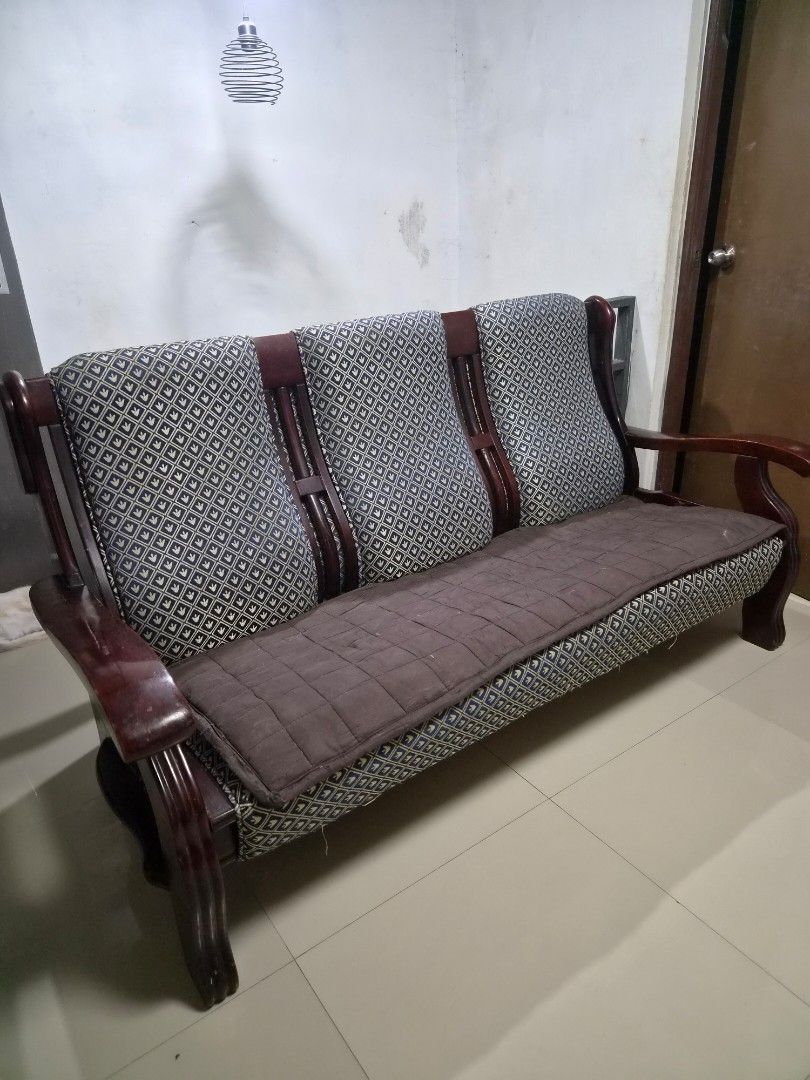 Dragon Sala Set_ Sofa Chair with Patterned Cushions (Category: Sofas) located in Caloocan City. Submitted by grandflower.2c6677 (Listing ID 1464669684, Image 1). Description: - Elegant wooden sofa chair with a dark, polished finish. - Features comfortable patterned seat and back cushions. - Includes a stylish quilted brown throw for added coziness. - Sturdy construction ensures durability. - Ideal for enhancing your living room or study space. RF