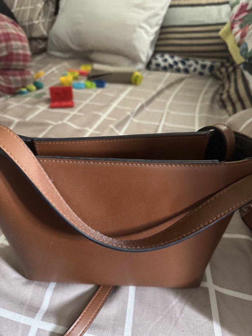EazyPeazy 3 Way Buckle Bag (Category: Shoulder Bags) located in Pasay City. Submitted by mchntal (Listing ID 1464592800, Image 2). Description: - Cute brown bucket bag - Made of faux leather - Features a single strap - Ideal size for everyday essentials - barely used Loc: Pasay RFS: need funds.