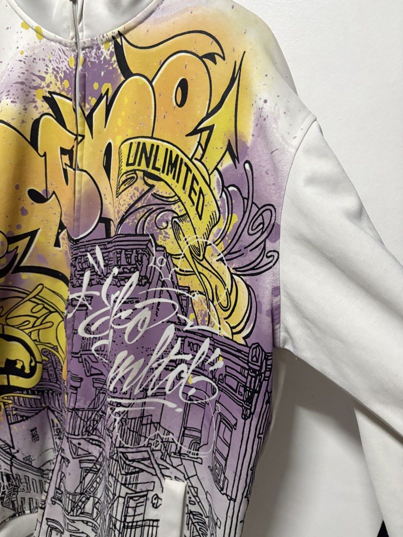 Ecko Unltd Full Zip Graffiti Print Track Jacket XL (Category: Coats, Jackets and Outerwear) located in Manila. Submitted by skeletal_v2 (Listing ID 1464743585, Image 3). Description: ECKO UNLTD- AOP GRAFFITI NEW YOUR 5000+SF 26/32 GOOD CONDITION COLOR RATE 9.2/10 - Brand: Ecko Unltd - Size: XL - Color: White with yellow and purple graffiti street art graphics - Details: Full zip, mock neck with black interior lining, front pockets, ribbed cuffs w