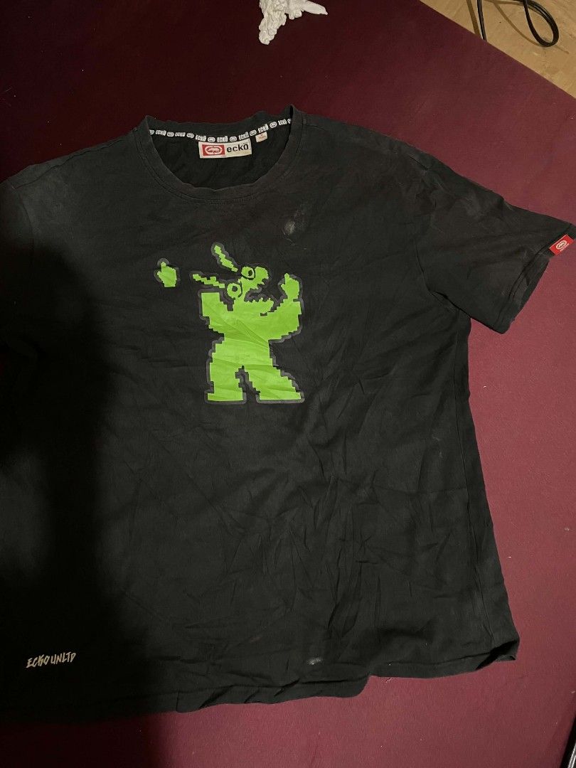 Ecko Unltd Pixel Graphic T-Shirt Black Size M (Category: Tshirts & Polo Shirts ) located in Cagayan de Oro. Submitted by rhyrhyrhys (Listing ID 1464739757, Image 1). Description: - Brand: Ecko Unltd - Size: Medium - Color: Black with green pixel monster graphic - Authentic - cheap cuz the neck is loose - I already washed the stains.
