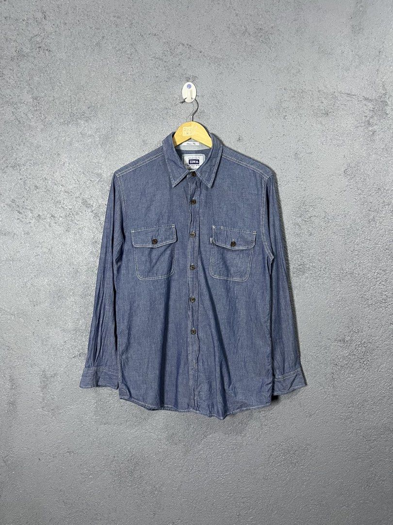 Edwin Denim Long Sleeve Button Down Shirt Size M (Category: Formal Shirts) located in Famy. Submitted by basicthrifted (Listing ID 1464703842, Image 1). Description: - Brand/Model: Edwin (ET2001) - Color: Blue denim with contrasting white stitching - Size: Medium (Best fits chest 88-96 cm, height 165-175 cm) - Fit: Relaxed fit design - Details: Dual chest pockets with flaps, dark tortoiseshell buttons, and woven Edwin tag on the right pocket - Sl