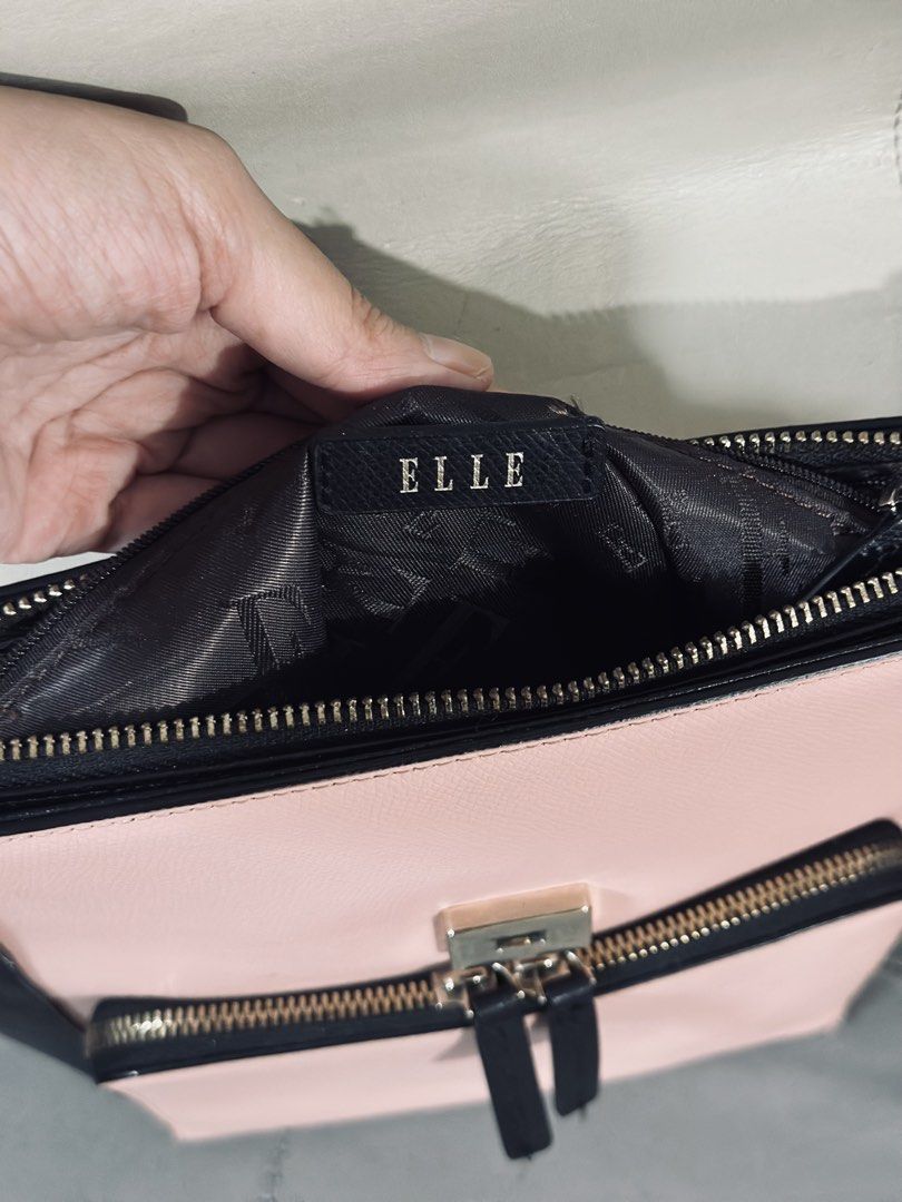 ELLE Colorblock Backpack - Black, White, Pink (Category: Backpacks) located in Tarlac. Submitted by via_banana (Listing ID 1464672590, Image 3). Description: - Cute colorblock design from ELLE - Features black, white, and pink panels - Top handle and adjustable shoulder straps for comfort - Front pocket with zipper closure for easy access - Main compartment also zips securely - Ideal for everyday use or travel adventures.