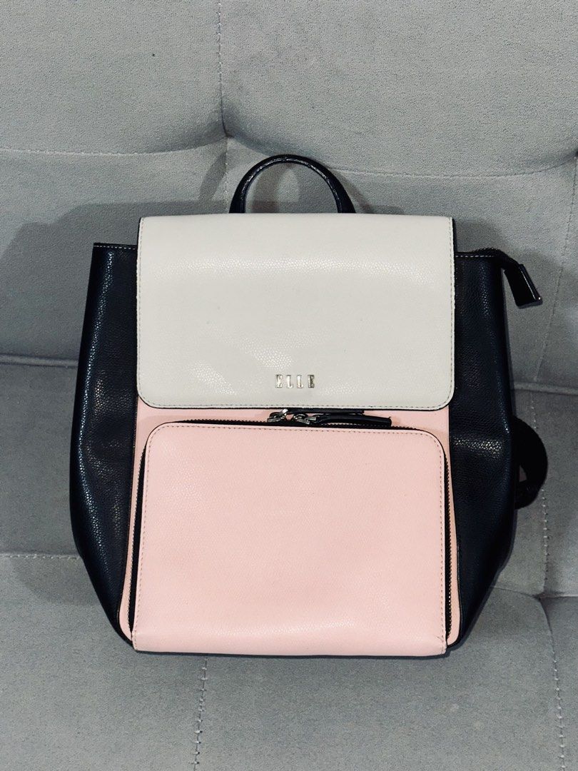 ELLE Colorblock Backpack - Black, White, Pink (Category: Backpacks) located in Tarlac. Submitted by via_banana (Listing ID 1464672590, Image 1). Description: - Cute colorblock design from ELLE - Features black, white, and pink panels - Top handle and adjustable shoulder straps for comfort - Front pocket with zipper closure for easy access - Main compartment also zips securely - Ideal for everyday use or travel adventures.