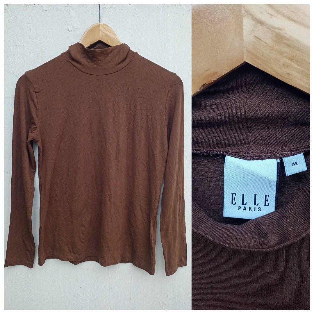 ELLE Paris Choco brown turtle neck (Category: Others Tops) located in Davao. Submitted by kannikasok1987 (Listing ID 1464586671, Image 1). Description: medium on tag made in India cotton mall quality.