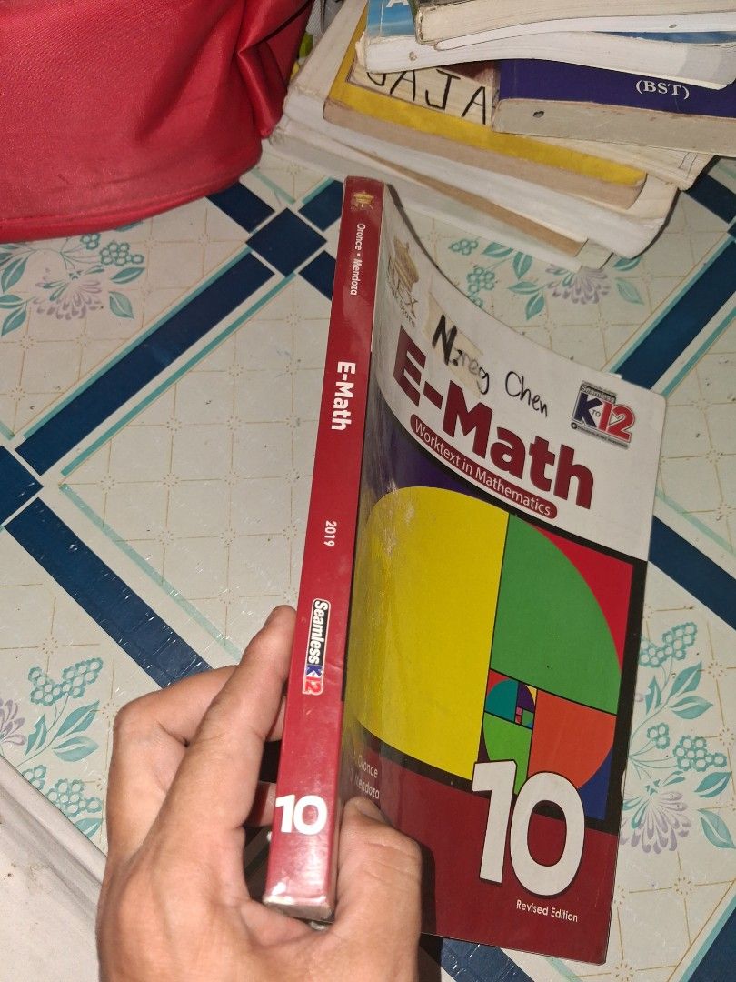 E-Math Worktext in Mathematics Grade 10 Revised Edition (Category: Textbooks) located in Manila. Submitted by marcas022798212 (Listing ID 1464616490, Image 2). Description: - E-Math Worktext in Mathematics for Grade 10 - Revised Edition - Published by REX Book Store - Authors: Orlando A. Cronce & Marilyn O. Mendoza - Key Topics: Patterns and Algebra, Polynomial Functions, Circles - Perfect for students seeking a thorough math resource.