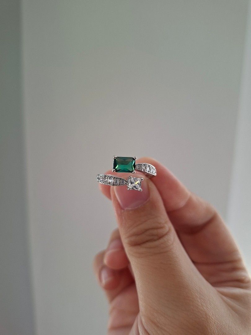 Emerald and White Crystals Silver Adjustable Ring Stainless Steel (Category: Rings) located in Dasmarinas. Submitted by danabrie22 (Listing ID 1464621715, Image 1). Description: adjustable size 5 - 9 very well-made, excellent crafstmanship 10/10 condition brand new stainless steel & green & white crystal-colored cubic zirconia stones made in Hongkong.