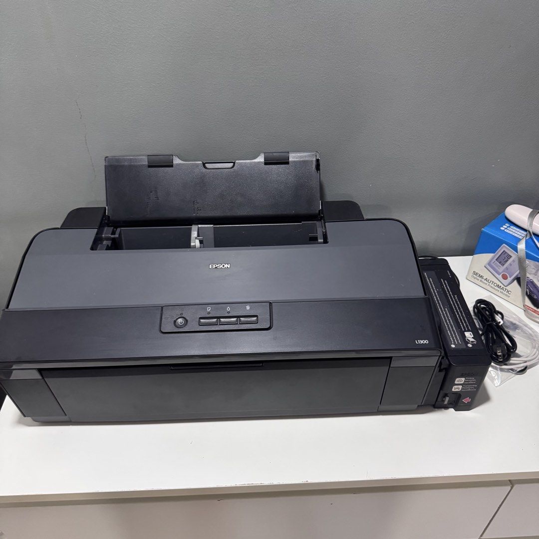 Epson L1300 Ink Tank Printer (Category: Printers, Scanners & Copiers) located in Manila. Submitted by costephen (Listing ID 1464683780, Image 1). Description: Epson L1300 good condition no issues Bought for 22000 srp brandnew Has small stain on ink gasket and some dust only Selling for 14000 negotiable Location sm sanlazaro or lalamove shouldered by buyer.