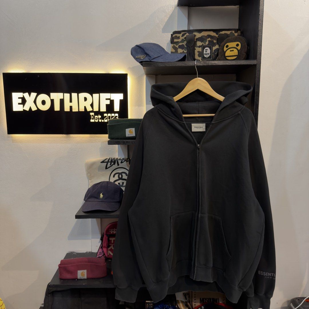 Essentials Zip Up Triple Black Hoodie (Category: Hoodies) located in Manila. Submitted by jerichomal82553 (Listing ID 1464751583, Image 1). Description: Essentials Zip Up Triple Black Hoodie 28 by 31 Good Condition Complete Tags CLAIM 2k.