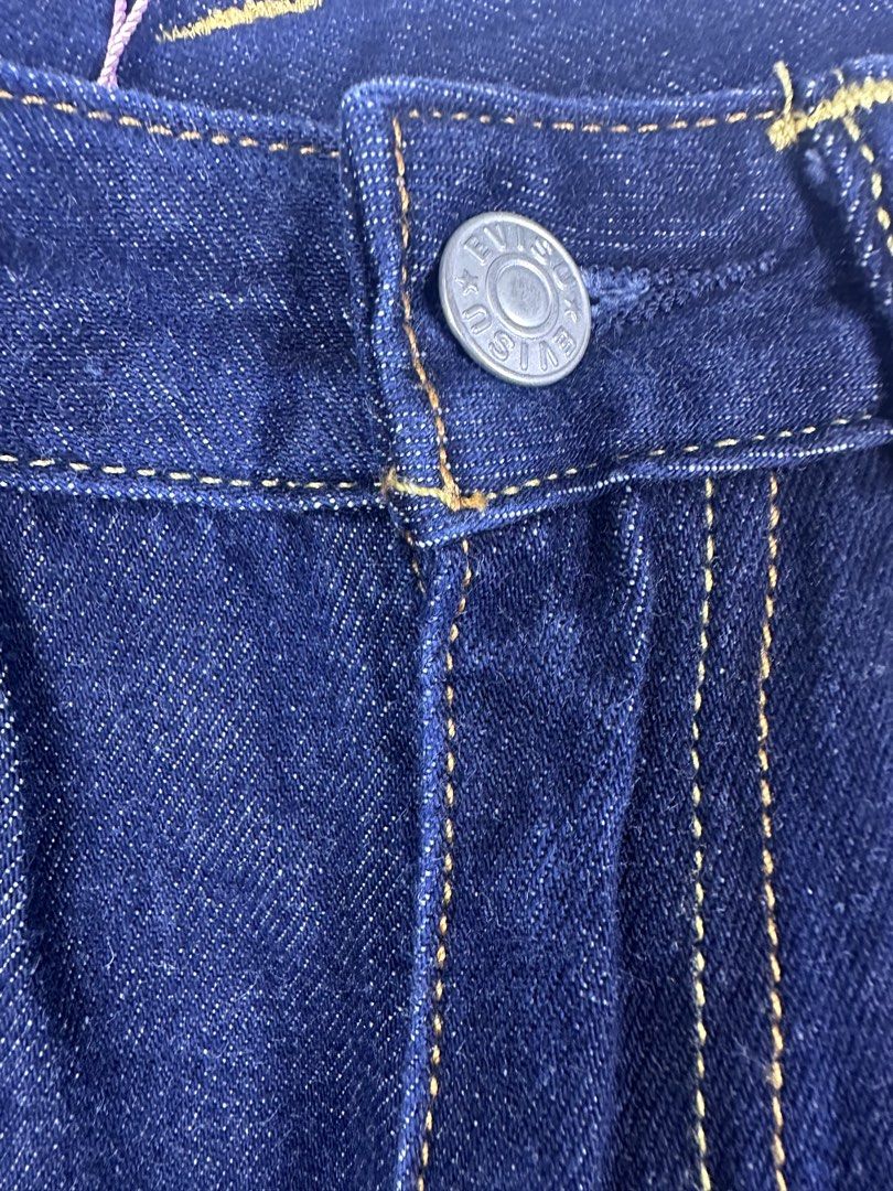 EVISU 91 Custom Made Jeans with Patches (Category: Jeans) located in Manila. Submitted by declutterpromax (Listing ID 1464617269, Image 2). Description: - Dark wash Evisu jeans - Iconic Evisu logo patches all over - Button fly closure - Leather patch on the back - Size: 28x34 - A great statement piece.