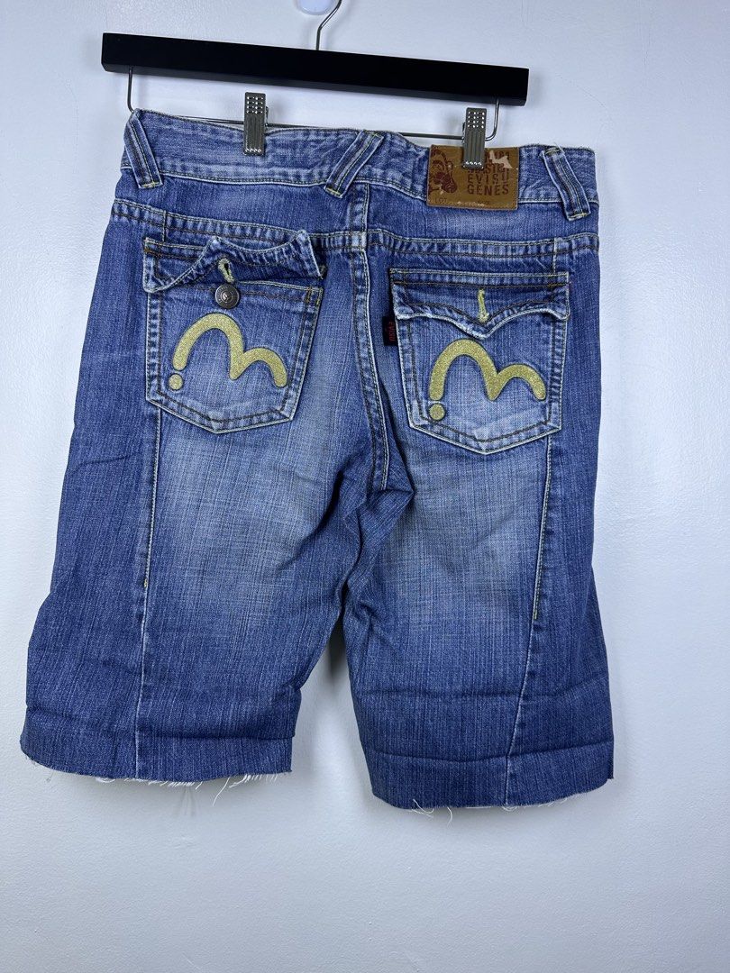 Evisu Genes Denim Shorts (Category: Shorts) located in Manila. Submitted by declutterpromax (Listing ID 1464617994, Image 3). Description: - Brand: Evisu Genes - Type: Blue Denim Shorts - Style: Distressed with frayed hem - Features: Classic Evisu stitching on back pockets, button fly closure - Occasion: Great for casual wear.