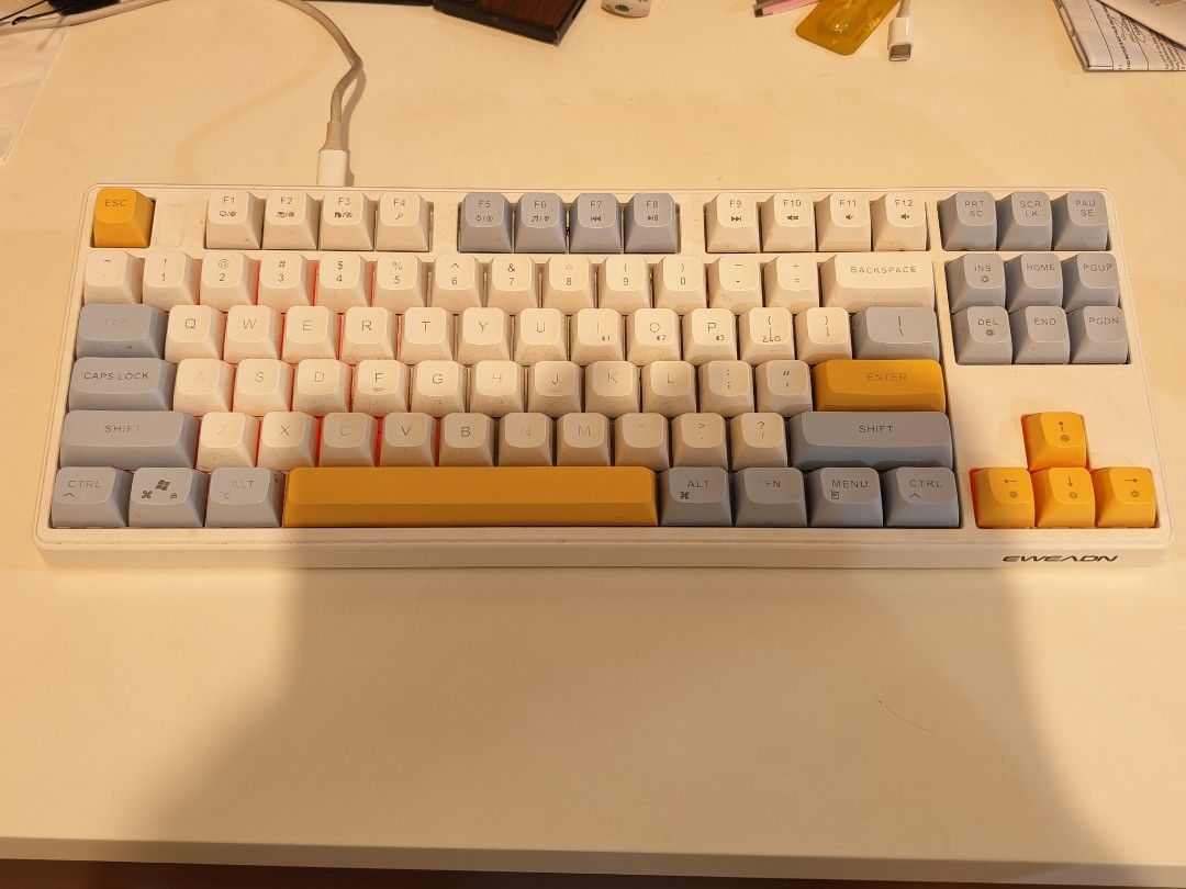 Eweadn E87 Mechanical Keyboard (only Sep 29th) (Category: Computer Keyboard) located in Manila. Submitted by oddowl-a357 (Listing ID 1464743393, Image 1). Description: - Model: Eweadn E87 Custom Triple-Mode Mechanical Keyboard - Layout: TKL (Tenkeyless) with a clean white, grey, and yellow keycap colorway - Connection: Wired via USB cable positioned securely at the top - Key Configuration: Standard English QWERTY with dedicated function row and a