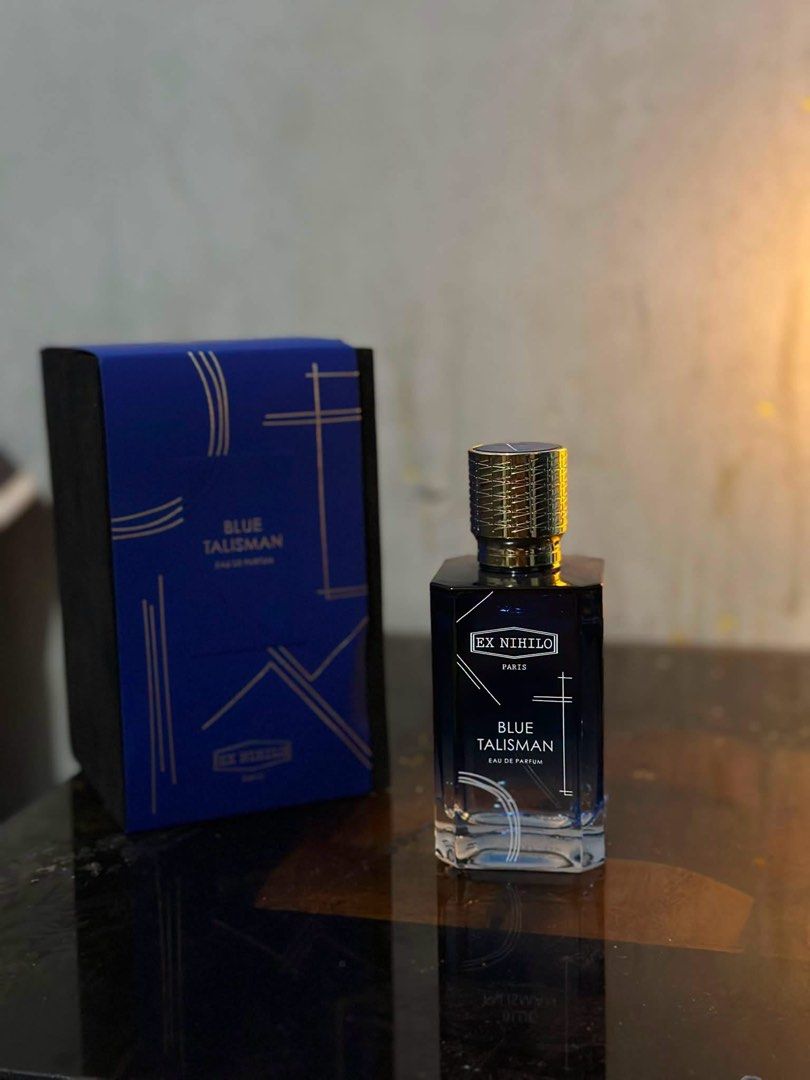 Ex Nihilo Blue Talisman Eau de Parfum (Category: Fragrance & Deodorants) located in Makati City. Submitted by charmelo21 (Listing ID 1464713021, Image 1). Description: - 100% Authentic Ex Nihilo Blue Talisman eau de parfum - Comes with original blue and black presentation box - Features a stunning glass bottle with white graphic print and ornate textured cap - Full retail packaging included, perfect for gifting or personal use.