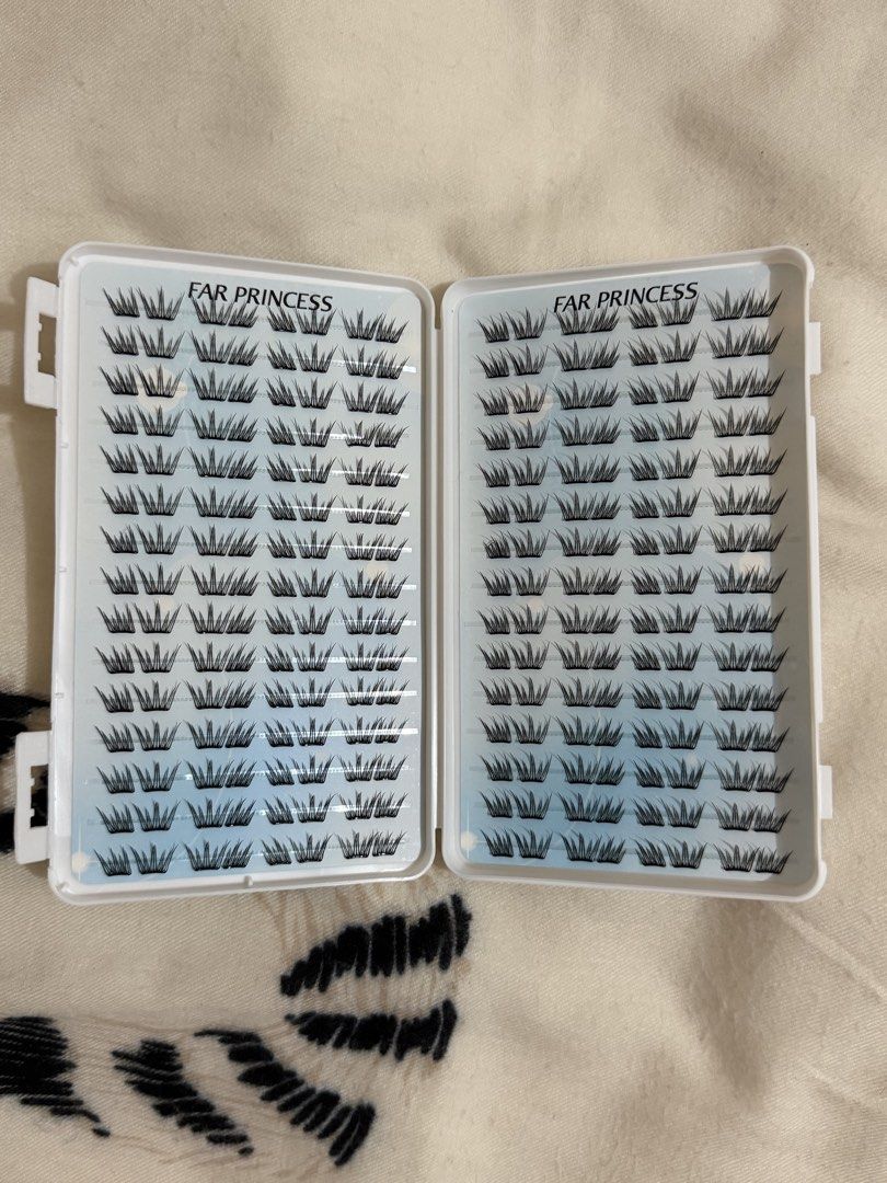 FAR PRINCESS Individual Cluster False Eyelashes Tray (Category: Makeup) located in Manila. Submitted by mengxir20193848 (Listing ID 1464717576, Image 1). Description: - Brand: FAR PRINCESS - Item: Individual cluster false eyelashes in a white storage case - Condition: Brand new, full, and untouched - Features: Multiple rows of black clustered lashes on clear strips - Perfect for DIY at-home lash extensions and easy to pick up with tweezers - Grea