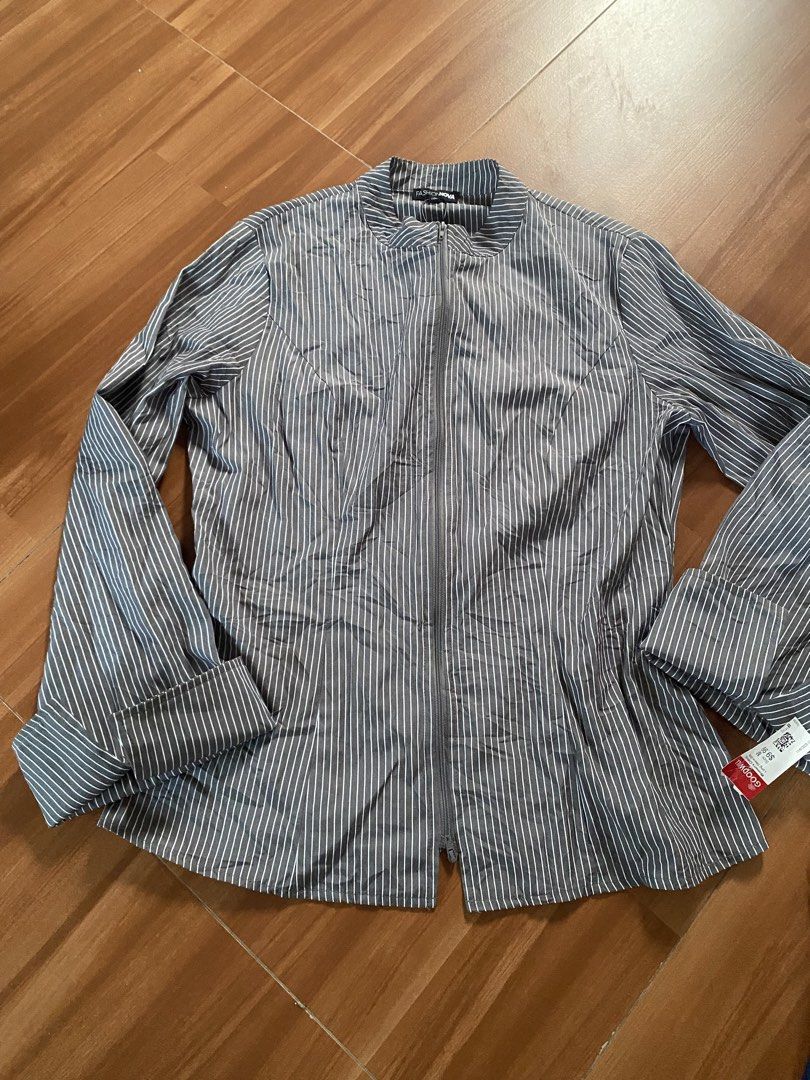 Fashion Nova Striped Zip-Up Jacket (Category: Coats, Jackets and Outerwear) located in Manila. Submitted by reginemarquez412 (Listing ID 1464673414, Image 1). Description: - Fashion Nova grey and white pinstripe jacket - Zip-up front with stand-up collar - Long sleeves with flared cuffs - Fitted waist - Versatile for layering or wearing solo.