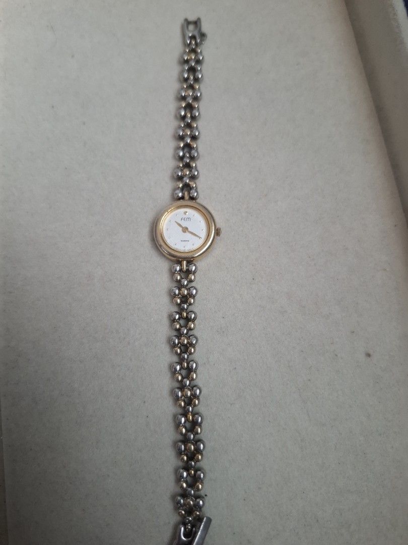 Fem Micro Watch (Category: Women's Watches) located in Abucay. Submitted by icia_marie18 (Listing ID 1464583839, Image 2). Description: Fem Watch 2 tone issue: major fadings and hairline scratches micro watch.