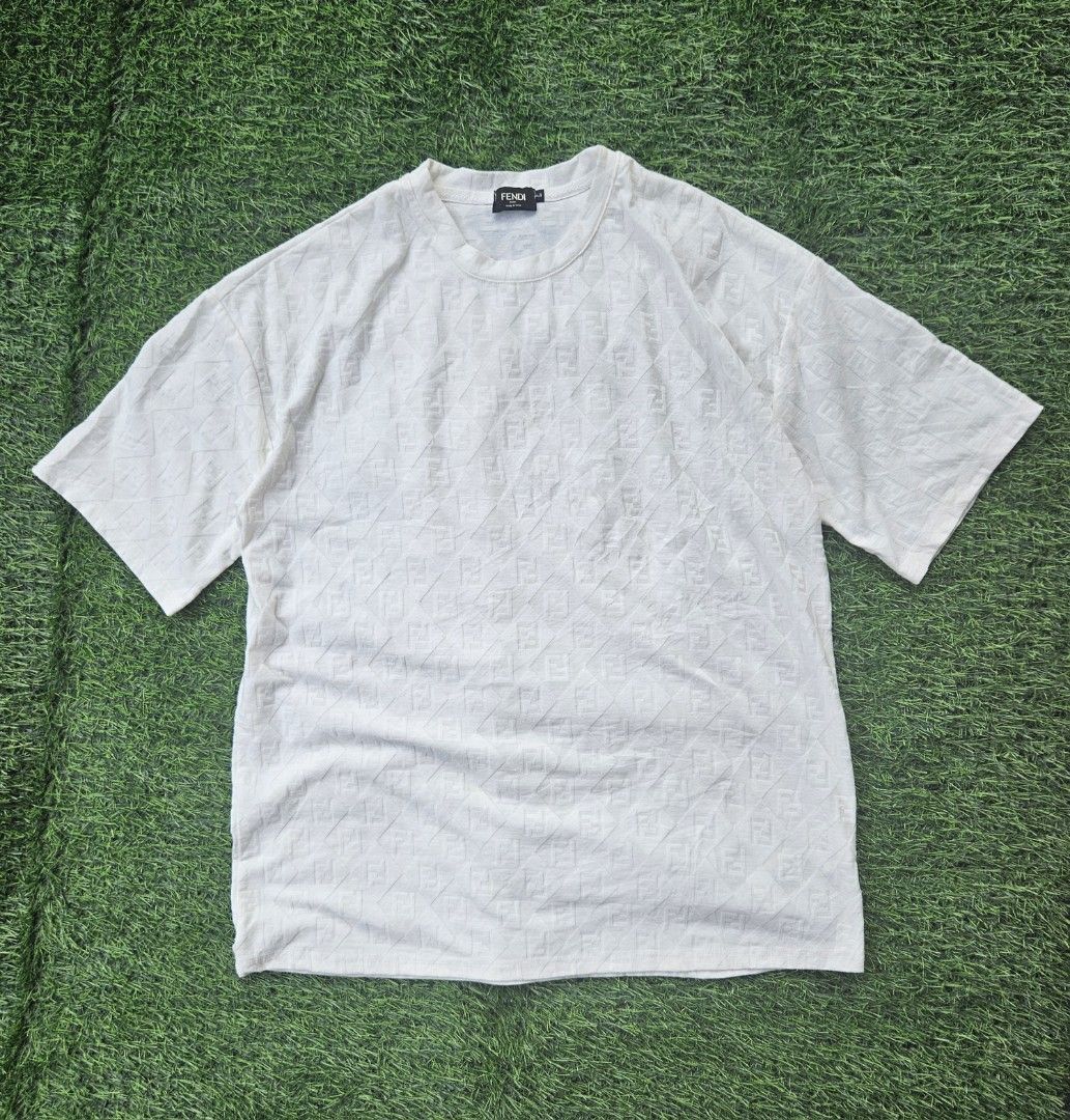 Fendi FF Monogram Knitted Shirt (Category: Tshirts & Polo Shirts ) located in Las Pinas. Submitted by rcp123 (Listing ID 1464638739, Image 1). Description: - Authentic Fendi T-shirt - All-over FF logo pattern - Color: White - Material: 100% Cotton - Made in Italy - Size: L - Ideal for everyday wear - Please check photos for condition details 27 x 21.