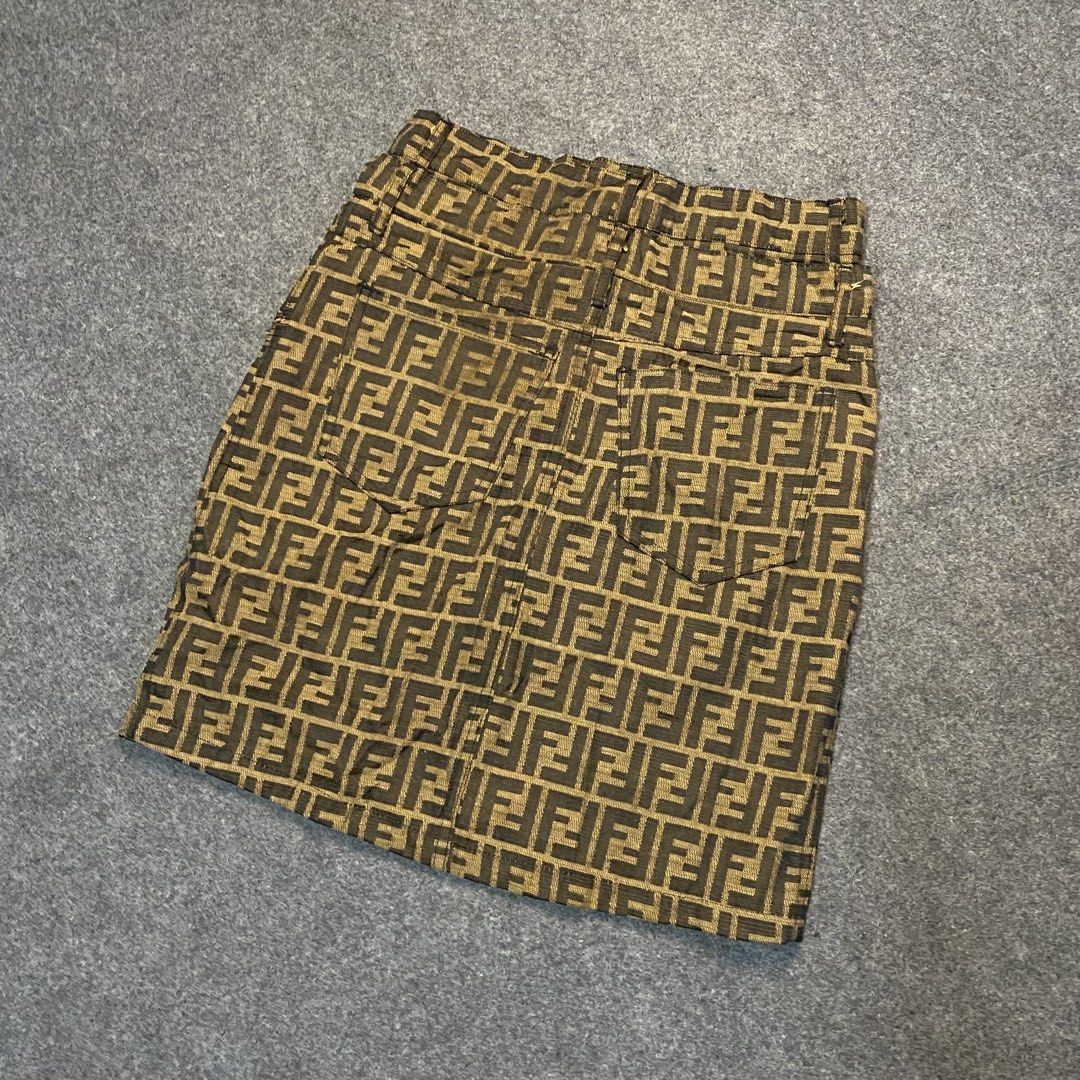 Fendi Jeans FF Monogram Mini Skirt (Category: Skirts) located in Cebu City. Submitted by callmejasonx (Listing ID 1464656350, Image 3). Description: - Classic Fendi Jeans mini skirt - Iconic all-over FF monogram pattern - Made in Italy by Ittierre S.p.A. - Comfortable cotton blend with spandex - Button closure at the waist - Perfect statement piece for fashion enthusiasts -Waist 28 -Lenght 19 -Hem 18 -Issue:See Last pic.