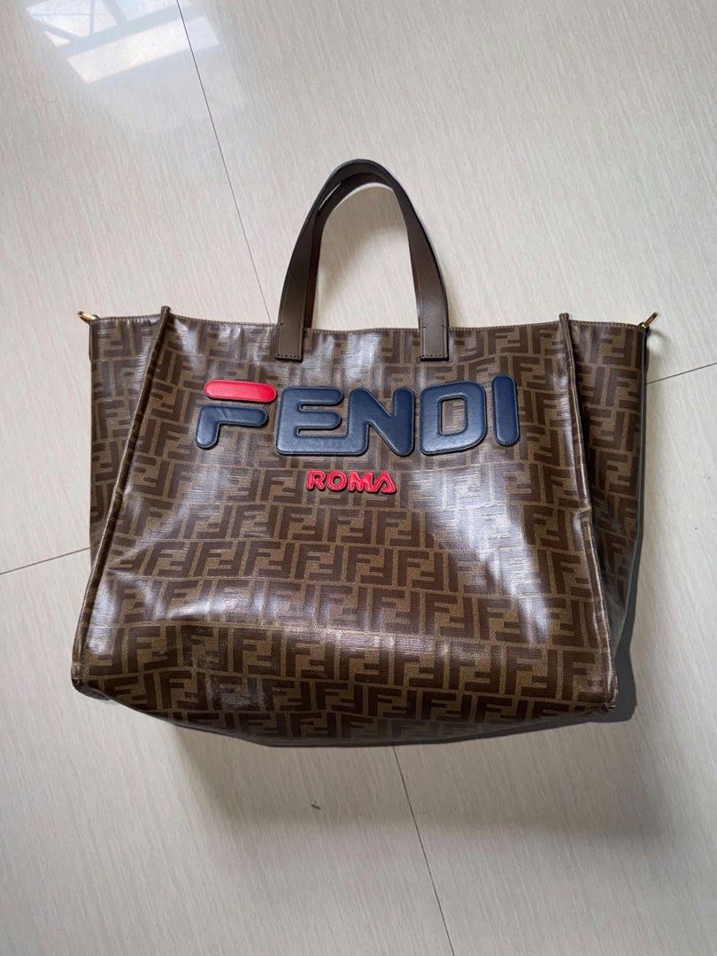 Fendi Roma Tote Bag (Category: Tote Bags) located in Caloocan City. Submitted by starosaeli09861 (Listing ID 1464613694, Image 1). Description: preloved luxury brand tote (f3ndi x f!la) - original with code - price negotiable - valenzuela, marulas - Authentic Brown Fendi Tote Bag - Iconic FF Pattern - Fendi Roma Logo in Blue and Red - Durable Leather Handles - Ideal for everyday use.