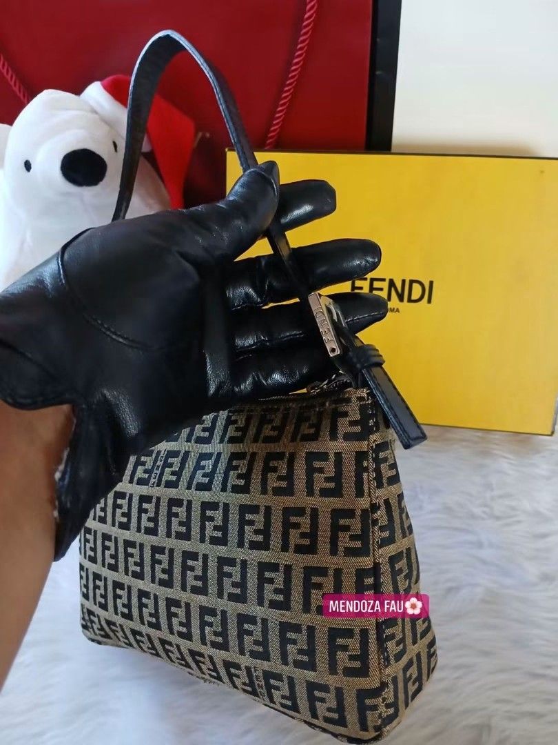 Fendi Zucca Print Shoulder Bag (Category: Luxury Bags & Wallets) located in Masinloc. Submitted by normanmndz31986 (Listing ID 1464756184, Image 3). Description: - Authentic MINI Fendi shoulder bag in iconic brown and black Zucca canvas - Features a short black leather strap with an adjustable metal buckle - Secure zip closure across the top - Comes complete with its original yellow Fendi box - Classic, timeless design perfect for daily use.
