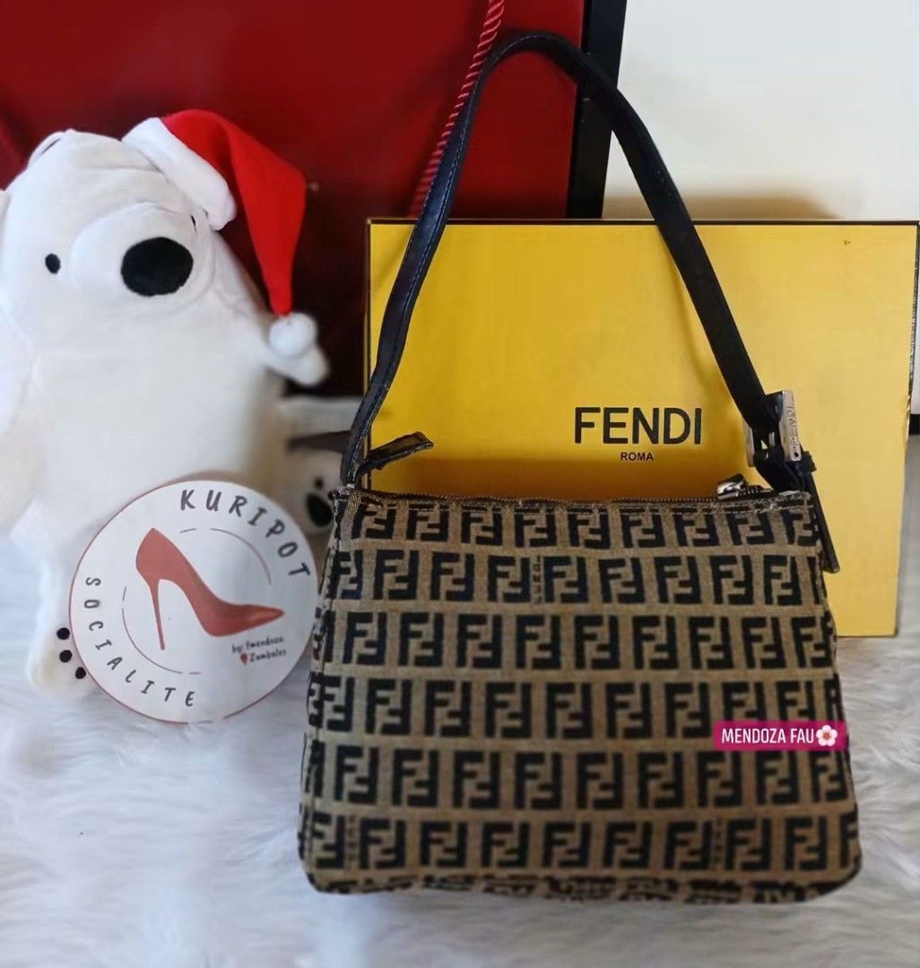 Fendi Zucca Print Shoulder Bag (Category: Luxury Bags & Wallets) located in Masinloc. Submitted by normanmndz31986 (Listing ID 1464756184, Image 2). Description: - Authentic MINI Fendi shoulder bag in iconic brown and black Zucca canvas - Features a short black leather strap with an adjustable metal buckle - Secure zip closure across the top - Comes complete with its original yellow Fendi box - Classic, timeless design perfect for daily use.