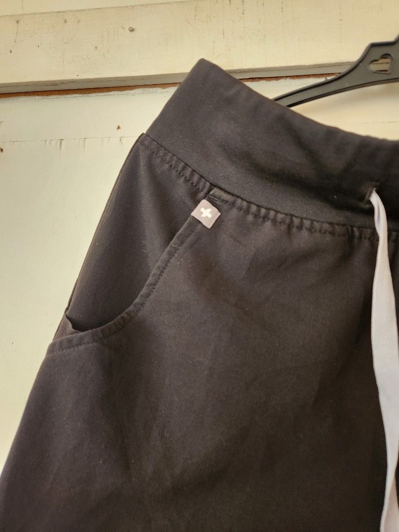 Figs black scrub pants joggers (Category: Other Bottoms) located in Lingayen. Submitted by brulee21 (Listing ID 1464593884, Image 2). Description: Figs Scrub Jogger Pants in black size XS/P has bleach stains, see pictures po loc: Sarangani.