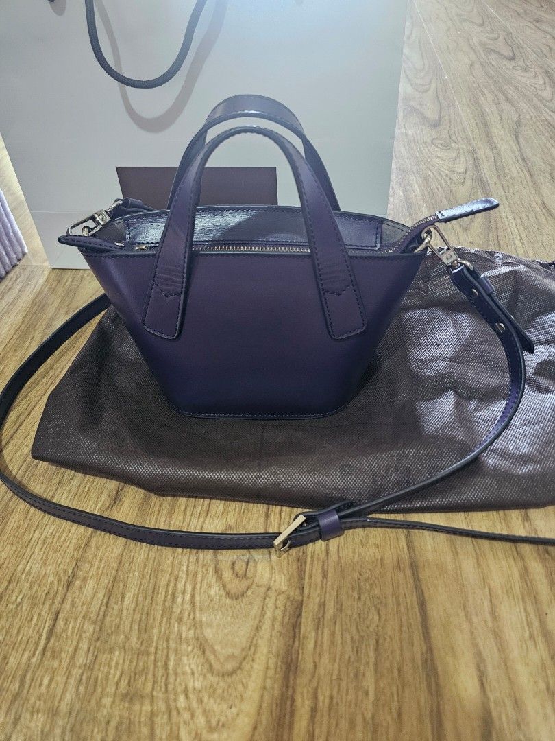 Fino Leathergoods Purple Top Handle Bag (Category: Luxury Bags & Wallets) located in Muntinlupa City. Submitted by netrich (Listing ID 1464570631, Image 2). Description: - Brand: Fino Leathergoods - Color: Purple - Style: Top handle bag - Features: Detachable shoulder strap, zipper closure - Includes: Dust bag, original box - Ideal for: Everyday use or special occasions.