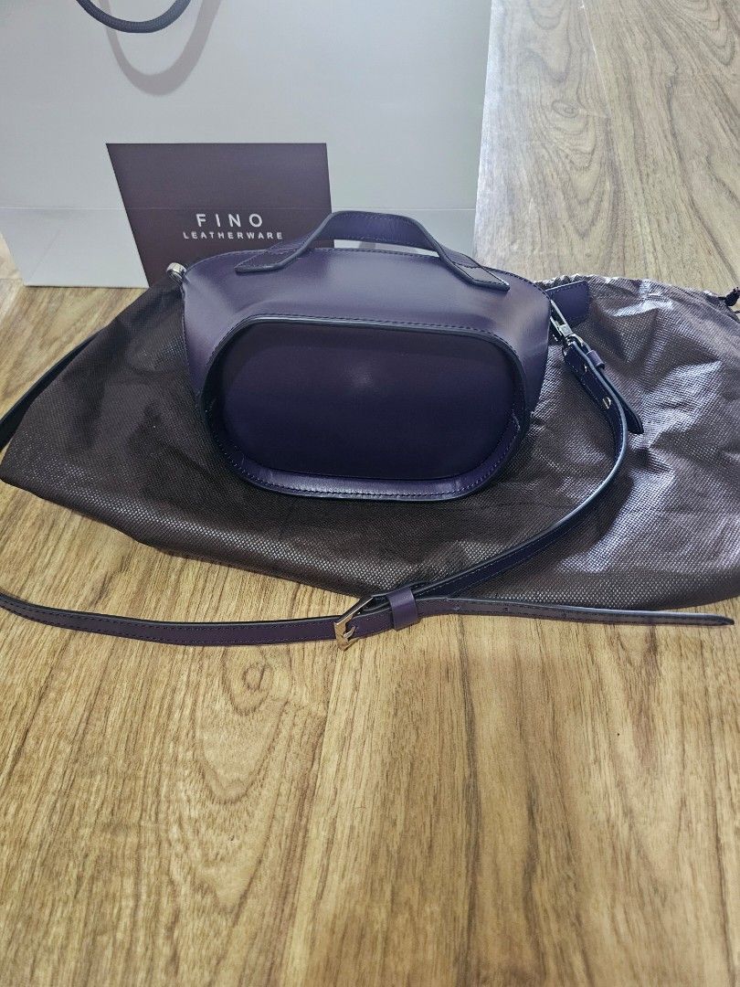 Fino Leathergoods Purple Top Handle Bag (Category: Luxury Bags & Wallets) located in Muntinlupa City. Submitted by netrich (Listing ID 1464570631, Image 3). Description: - Brand: Fino Leathergoods - Color: Purple - Style: Top handle bag - Features: Detachable shoulder strap, zipper closure - Includes: Dust bag, original box - Ideal for: Everyday use or special occasions.