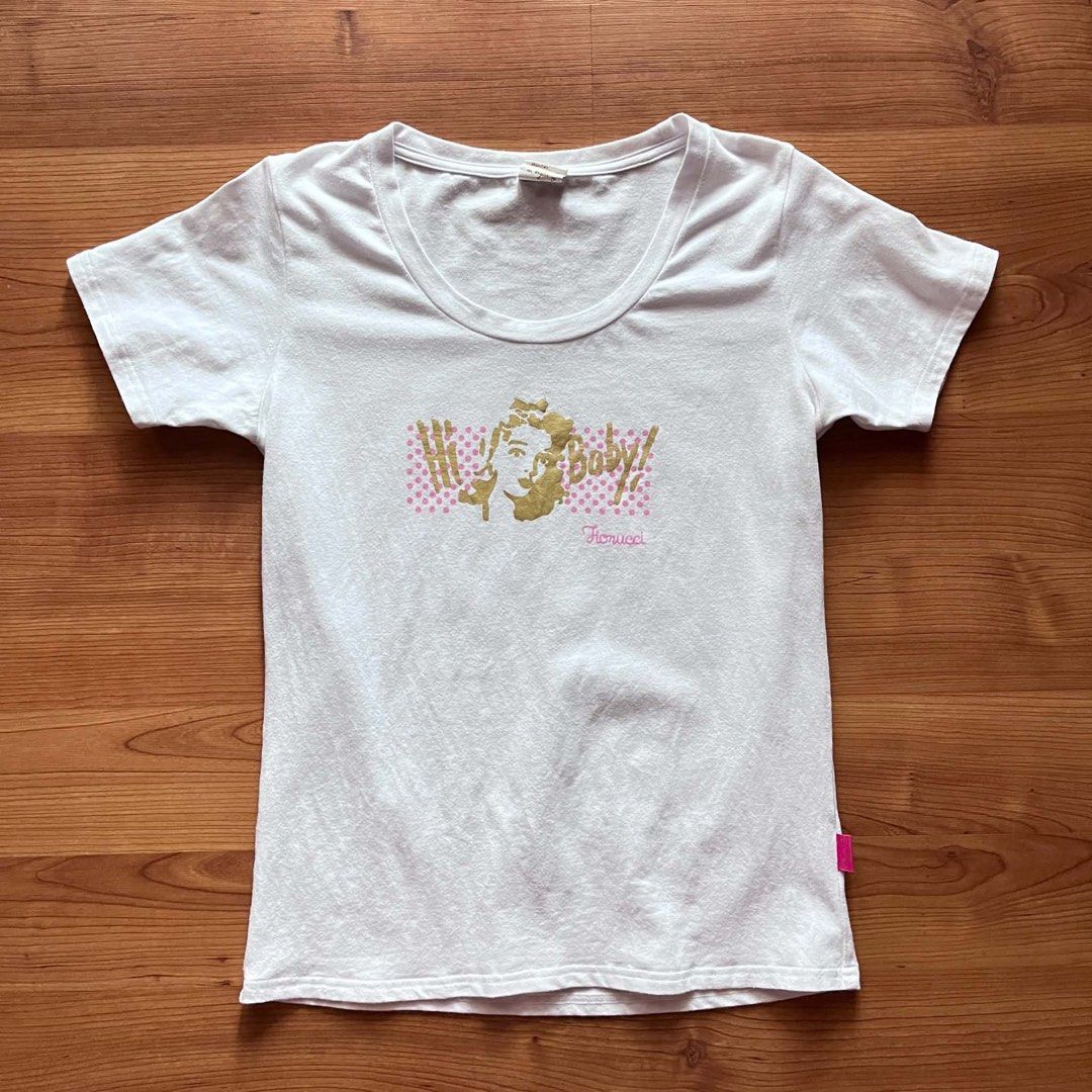 Fiorucci T-shirt (Category: Shirts) located in Rizal. Submitted by timelessfinds89_ (Listing ID 1464573837, Image 1). Description: Dimes: L23.5 W17 (size 2 fits S-M).