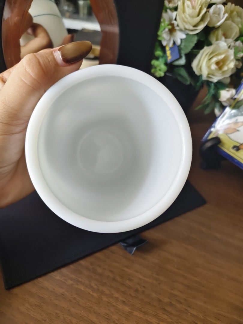 Fire King Milk Glass Mug Teal Stripe (Category: Coffee & Tea Tableware) located in Alaminos. Submitted by rarefinds1215 (Listing ID 1464604792, Image 3). Description: - Vintage Fire King mug - Milk glass with two teal stripes - Classic diner style - Perfect for coffee or tea - Marked on the bottom - A nice addition to any collection.