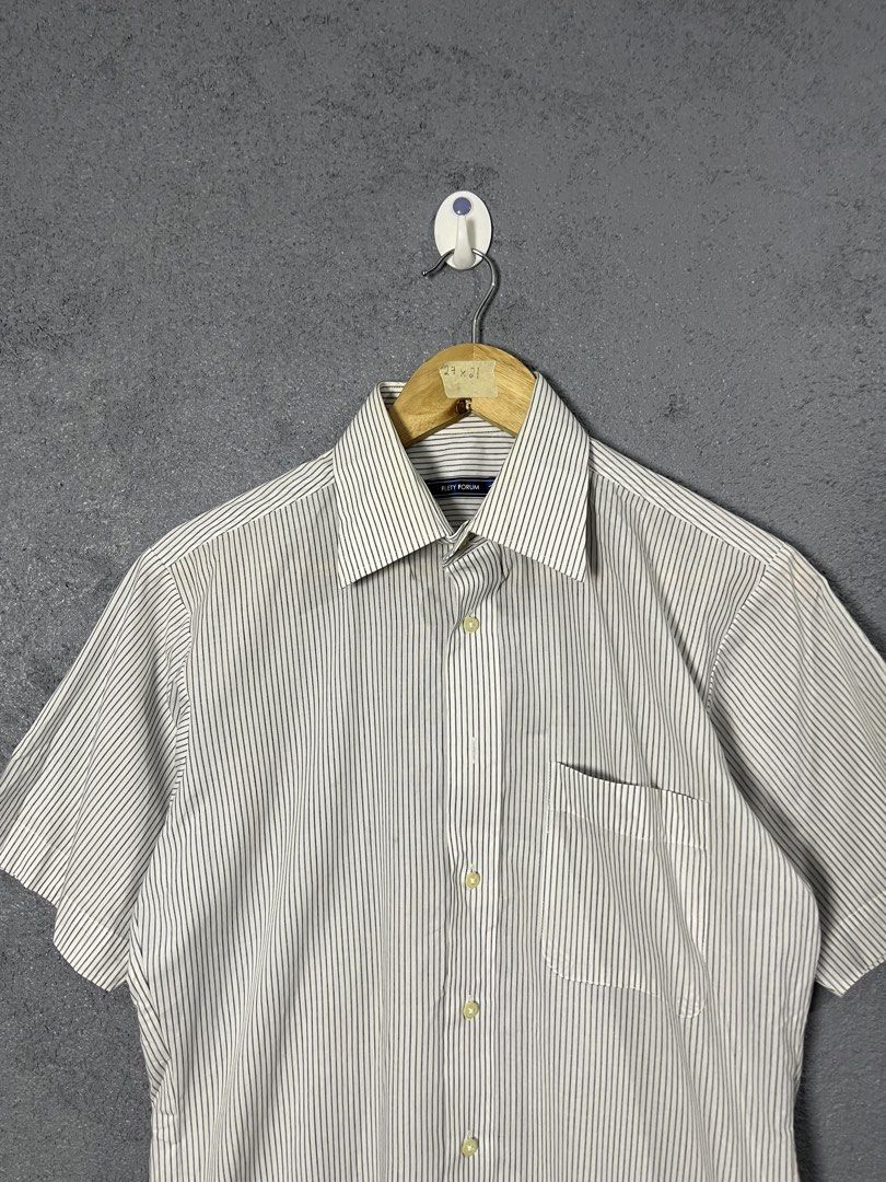 Flety Forum Short Sleeve Striped Button Down Shirt (Category: Tshirts & Polo Shirts ) located in Famy. Submitted by basicthrifted (Listing ID 1464704815, Image 2). Description: - Brand: Flety Forum - Style: Short sleeve button down shirt - Pattern: Classic black and white stripes - Details: Point collar, front button closure, single chest pocket - Fit & Size: Clean tailored fit, tagged size 27x21 - Fabric: Breathable, ideal for warm weather - Ver
