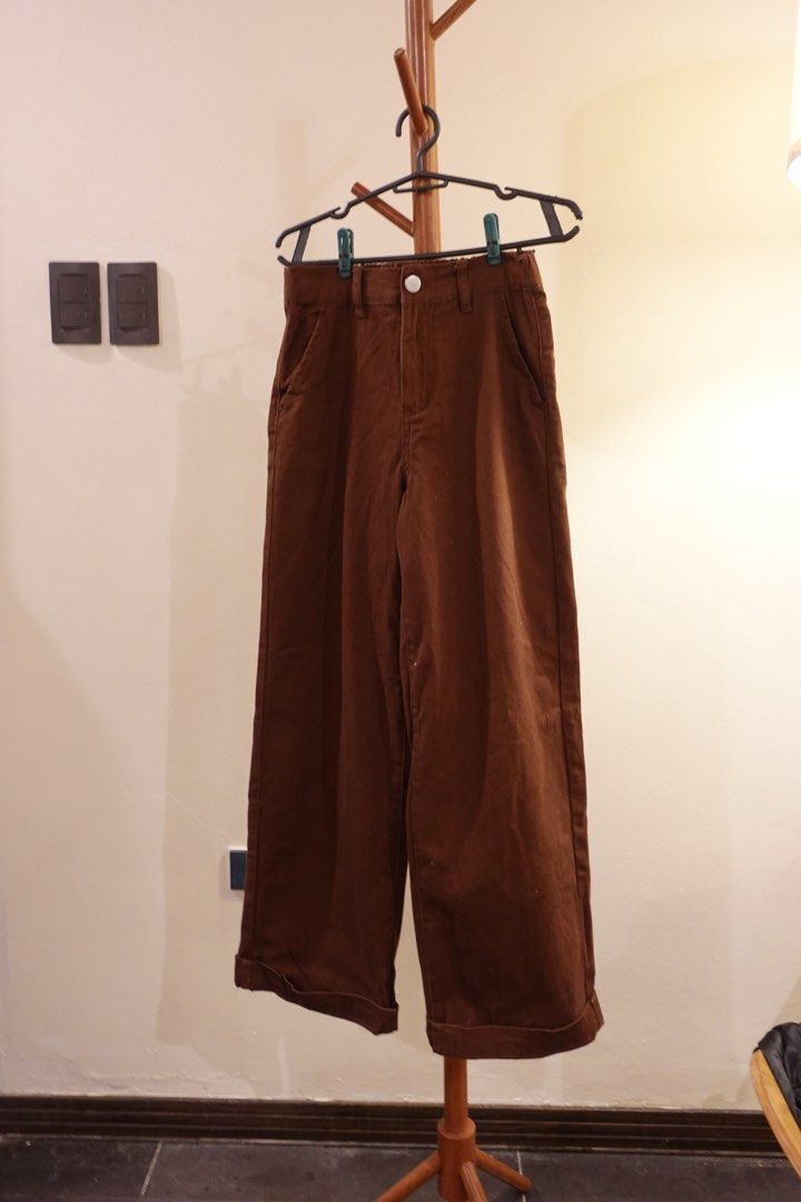 Forever 21 Brown Wide Leg Pants (Category: Jeans) located in Pasig City. Submitted by hulyascloset (Listing ID 1464622647, Image 1). Description: - Brand: Forever 21 - Style: Wide leg pants - Color: Brown - Waistband: Elastic at the back - Closure: Button and zip front - Pockets: Two side pockets - Hem: Cuffed - Features: Comfortable and stylish - Occasion: Great for casual wear RFS used ONCEEE and they didnt look good on me so pls take them.