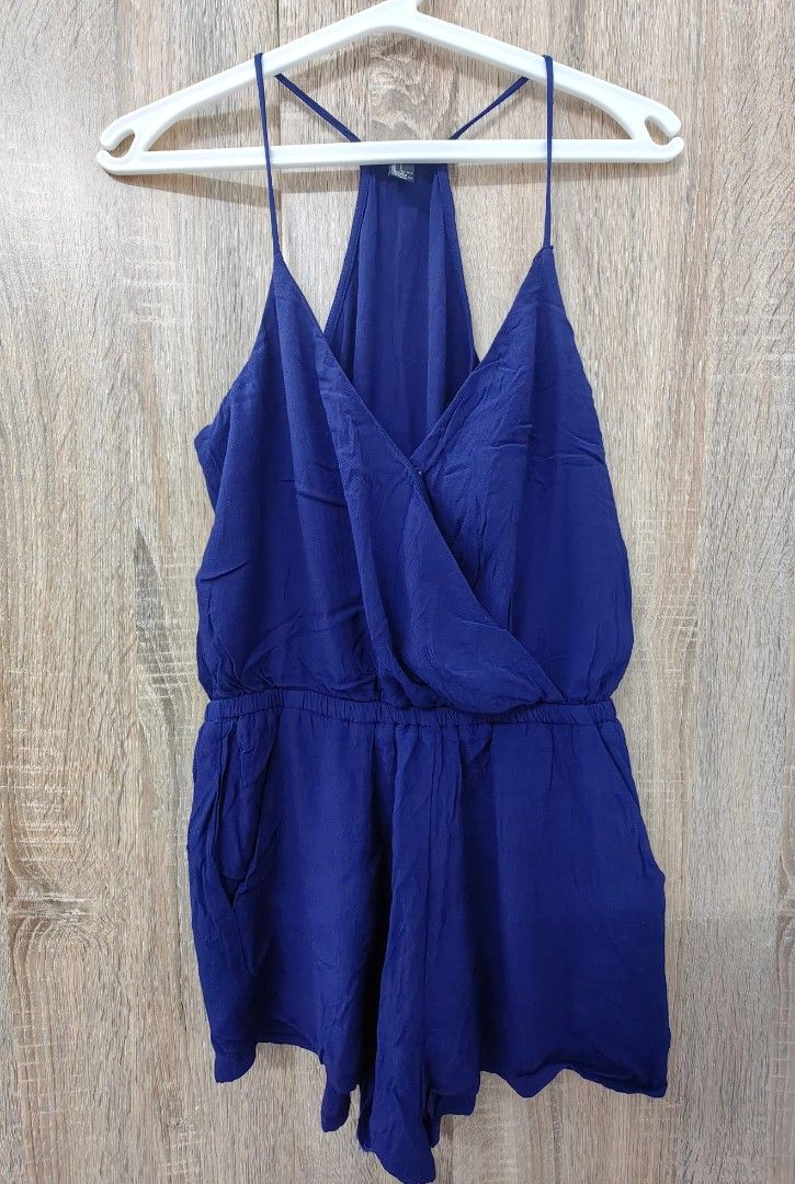 Forever 21 Royal Blue Spaghetti Strap Romper (Category: Rompers) located in Las Pinas. Submitted by offtonewhome (Listing ID 1464612519, Image 1). Description: - Royal blue romper from Forever 21 - Features spaghetti straps and a flattering halter neck - Elasticated waist for a comfortable fit - Convenient side pockets - Lightweight fabric, ideal for warm weather - Versatile for dressing up or down.