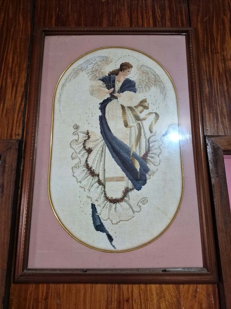 Framed Angel Cross-Stitch Artwork (Category: Frames & Pictures) located in Muntinlupa City. Submitted by googoosh_collection (Listing ID 1464609309, Image 1). Description: -Angel of Hope cross stitch with Frame -Exquisite framed cross-stitch artwork featuring a detailed angel. - Elegant wooden frame with a sophisticated gold inner trim. - Soft pink matting surrounds the beautiful stitching. - Comes ready to hang, perfect for adding charm to your 