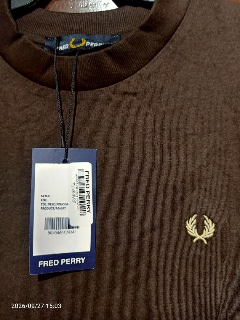 Fred Perry T-shirt Mens (Category: Tshirts & Polo Shirts ) located in Las Pinas. Submitted by OmengSoyT (Listing ID 1464721265, Image 2). Description: - Brand: Fred Perry - Color: Brown with yellow and dark trim on cuffs - Size: Medium (Standard fit) can fit to Large - 100% premium cotton fabric - Condition: Brand new with original store hang tag attached - Design: Short sleeves, crew neck collar, and signature embroidered laurel wreath logo on c