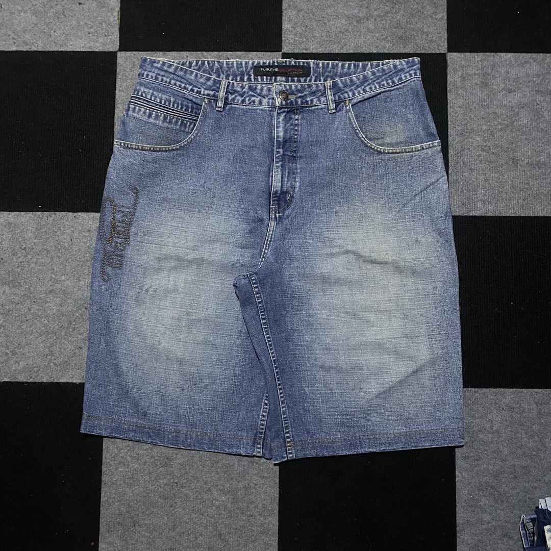 Fubu The Collection Denim Shorts (Category: Shorts) located in Manila. Submitted by gregmarc5503863 (Listing ID 1464752338, Image 1). Description: - Brand: Fubu (1992 era vintage) - Color/Wash: Washed blue - Style: Classic mid-length denim shorts (jorts) - Details: Contrast stitching, front embroidered Fubu logo graphic, branded back leather patch with metallic rivet - Closure: Button fly - Fit: Straight hem, comfortable streetwear essential FUBU
