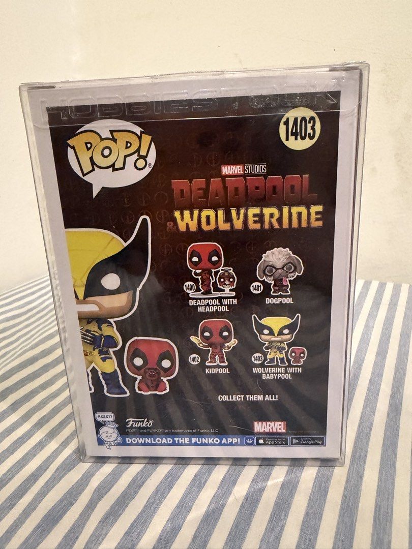 Funko Pop Marvel Wolverine with Babypool 1403 (Category: Figurines & Statues) located in Davao. Submitted by hungryapple_469 (Listing ID 1464620022, Image 3). Description: - Marvel Studios Deadpool & Wolverine Funko Pop! Vinyl Figure - Figure Number: 1403 - Features Wolverine with Baby Deadpool - Comes in its original, unopened box.