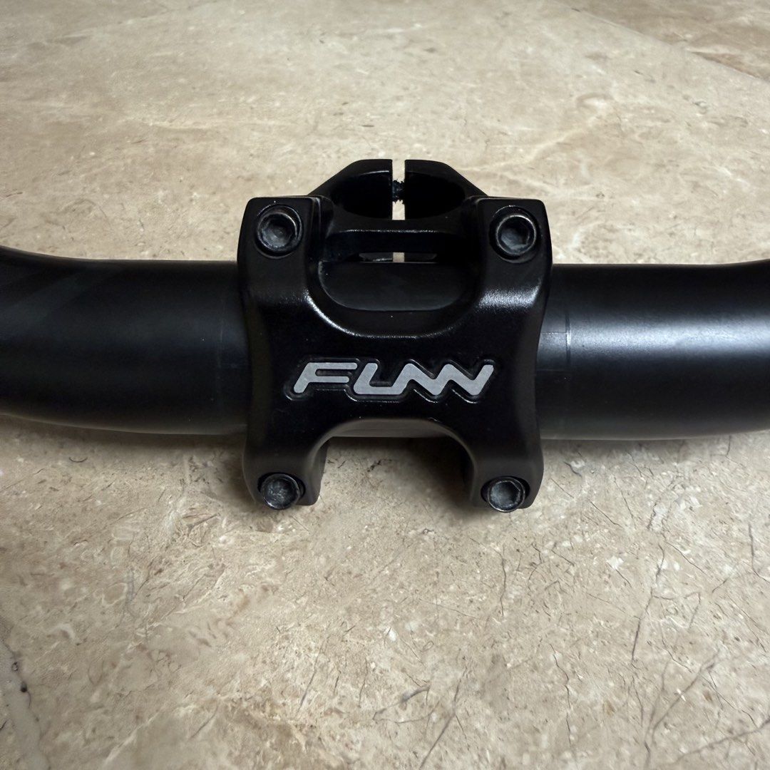 FUNN MTB Handlebar and Stem Package (Category: Bicycles) located in Muntinlupa City. Submitted by olxph_344800401 (Listing ID 1464616927, Image 2). Description: Pre-owed but in excellent condition. Kingpin Bar - 31.8 / 8deg back, 5.5deg up / 30mm rise / Cut to 765mm Crossfire Stem - 31.8 / 35mm length Extra: Deity grips (used) .