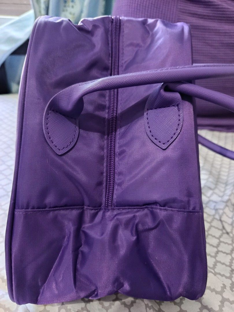 GANSO Purple Bag (Category: Tote Bags) located in Manila. Submitted by beckylafea (Listing ID 1464574408, Image 3). Description: - Brand: GANSO - Color: Purple - Material: Nylon-like - Features: Handles, Zipper closure - Ideal for: Travel, Gym - Dimensions: Approx. 12" (Length) x 6" (Width) x 7" (Height) - Condition: Spacious interior.