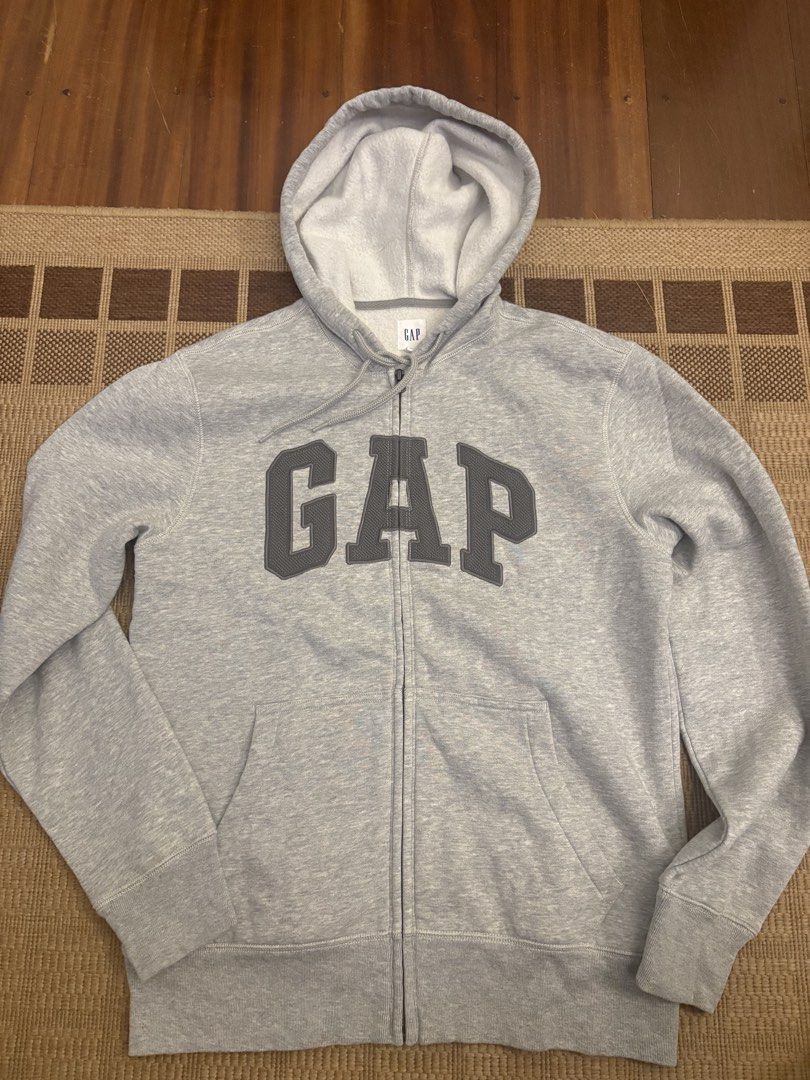 GAP Grey Zip-Up Hoodie (Category: Hoodies) located in Paranaque City. Submitted by max_bully014 (Listing ID 1464607972, Image 1). Description: - Grey zip-up hoodie from GAP - Features classic GAP logo across the chest - Includes a hood and a front pocket - Size: S - Ideal for casual everyday wear.