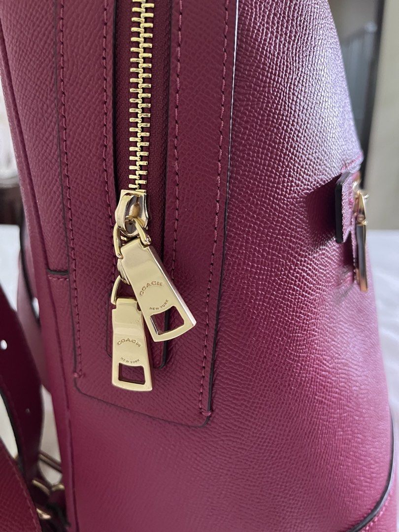 Genuine COACH Kenley Cross Grain Leather Bright Violet Backpack (Category: Backpacks) located in Mabalacat. Submitted by fourthoct (Listing ID 1464596811, Image 2). Description: ⭐️ Measurements are 10”wide, 13”2 high, 5” deep and two 32” back straps each. One main compartment with a back zipper pocket, two back pockets, top handle and a top zipper closure. This backpack is in excellent condition, well cared for, hang tag, exterior pocket for easy